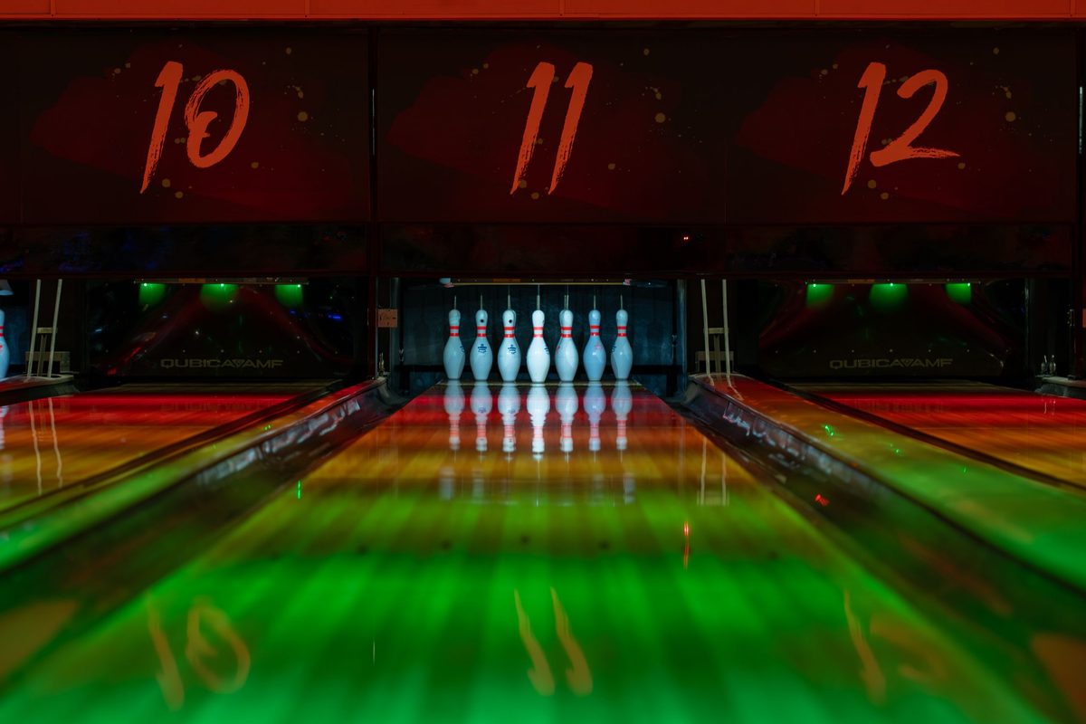 Glow bowling with neon-lit lanes, a popular night out at bowling centres in Malaysia