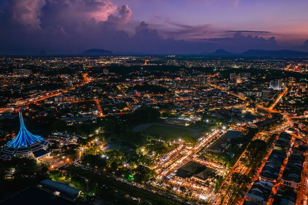 Kuching at night beside the Sarawak River, home of Sarawak bowling 2026 events