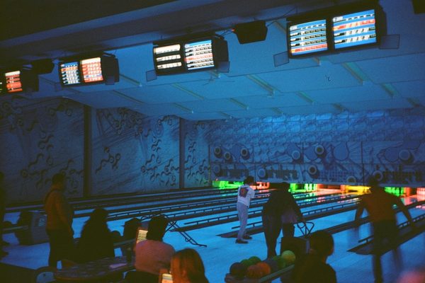 Overhead score monitor showing frame-by-frame scores, a familiar sight at bowling leagues in Malaysia